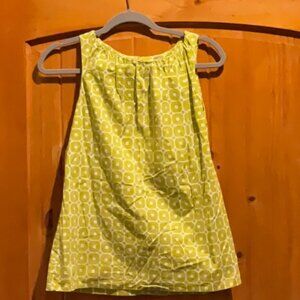 Lime and white sleeveless top.